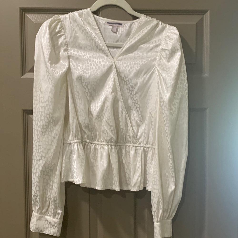 Cream long sleeve front crossover blouse.